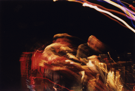 Chris and Alex whirled into a corroded neon vortex at On the Boards; photo by Carl Juarez.