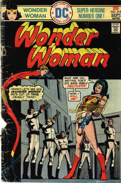 Smiling placidly, a 
tied and bound Wonder Woman bids her grim-faced male captors to kill 
her. Overhead, Elongated Man spies on the scene and records it with a 
portable movie camera. This issue was part of series where Wonder Woman, a 
long-time member of the Justice League of America, was unbeknownst 
to her, auditioning to rejoin the JLA.